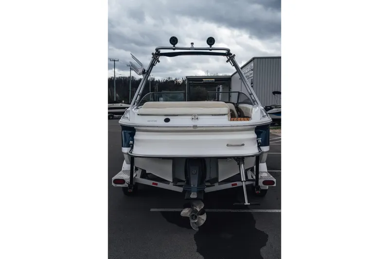 Slide: The Image of 2008 Cobalt 202 boat rear view, parked outdoors under cloudy skies. - 20