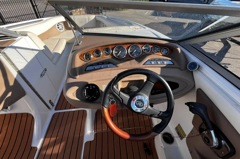 Slide: The Image of 2008 Cobalt 202 boat interior with steering wheel and dashboard controls. - 5