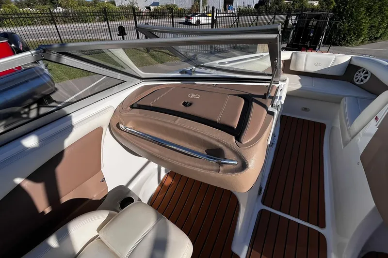 Slide: The Image of 2008 Cobalt 202 boat interior with tan seating and wood-style flooring. - 6