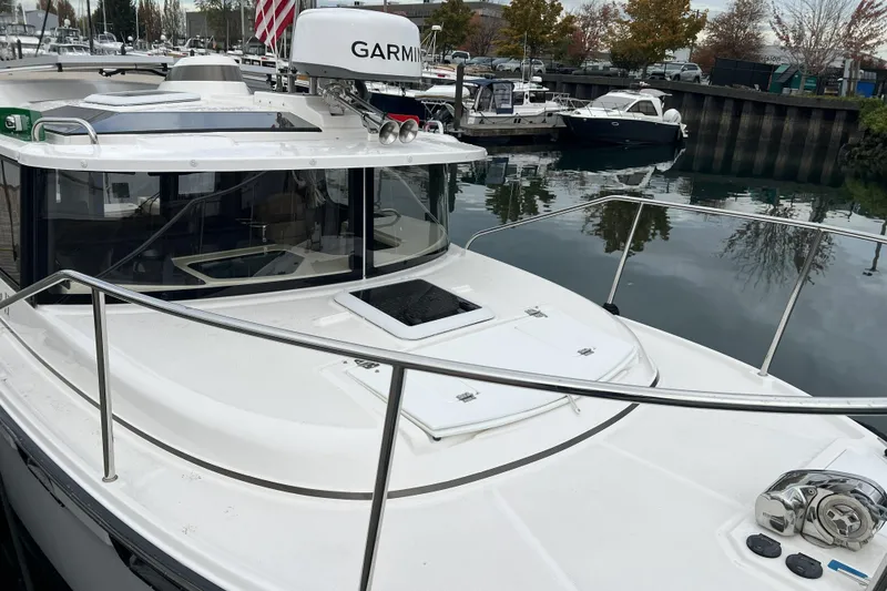 The Image of 2025 Ranger Tugs R-27 Luxury Edition docked, featuring sleek design and advanced navigation equipment. - 1