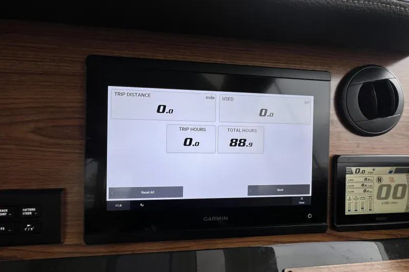 Slide: The Image of Dashboard of 2025 Ranger Tugs R-27 Luxury Edition with Garmin display showing trip data. - 17