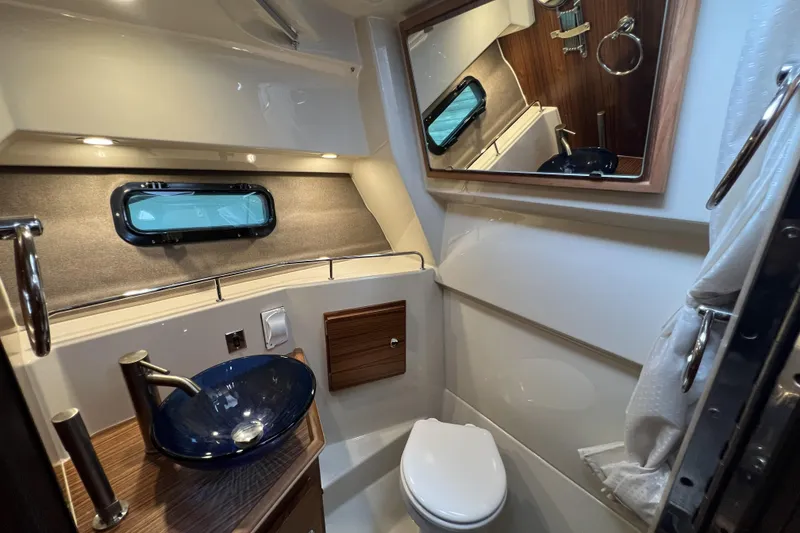 Slide: The Image of 2025 Ranger Tugs R-27 Luxury Edition bathroom with modern fixtures and elegant design. - 20