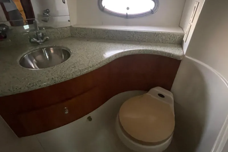 Slide: The Image of Bathroom interior of 2001 Carver 444 Cockpit Motor Yacht with sink and toilet. - 24