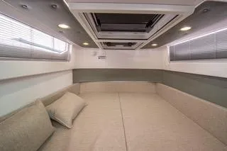 Slide: The Image of 2023 Axopar 37 dashboard with navigation and engine displays at marina. - 22