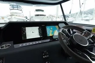 Slide: The Image of Interior view of 2023 Axopar 37 boat cockpit with modern navigation equipment. - 23