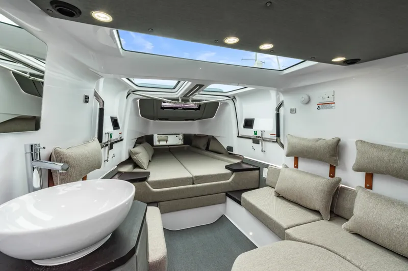 Slide: The Image of Luxurious interior of 2023 Axopar 37 boat with modern seating and skylight. - 28