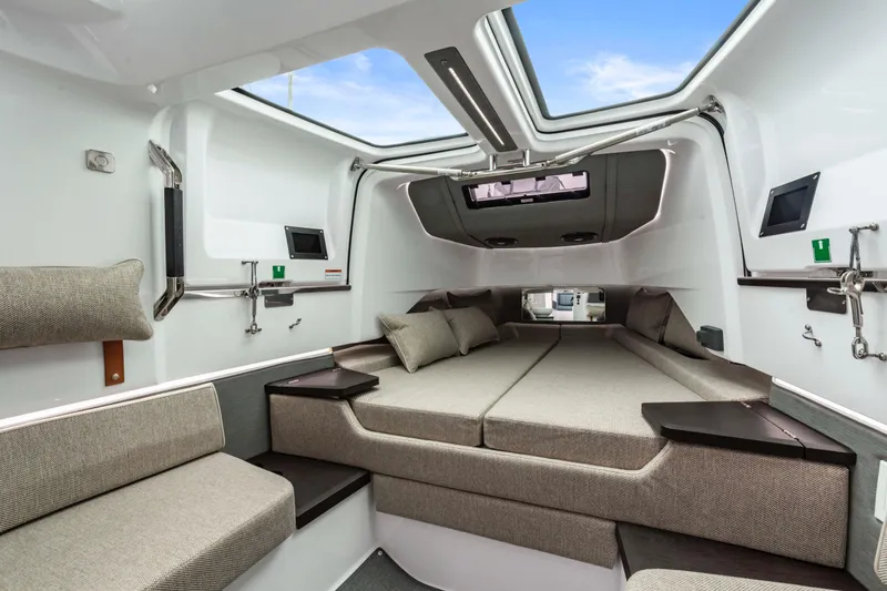 Slide: The Image of Luxurious interior of 2023 Axopar 37 boat with modern seating and skylight. - 29