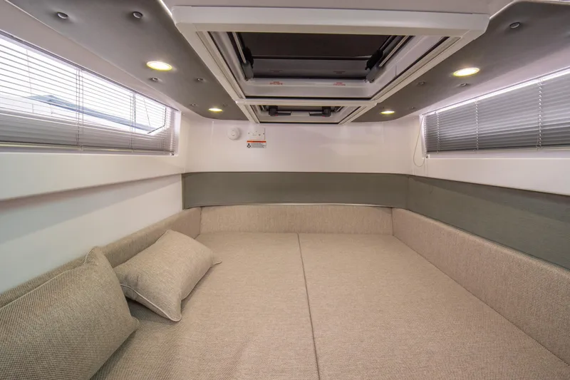 Slide: The Image of Luxurious interior cabin of 2023 Axopar 37 boat with modern design and comfortable seating. - 31