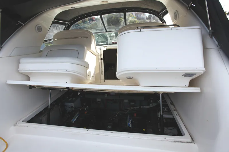 Slide: The Image of 1997 Sea Ray 330 Express Cruiser interior with open engine compartment. - 15