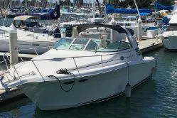 Slide: The Image of 1997 Sea Ray 330 Express Cruiser docked at a marina. - 29