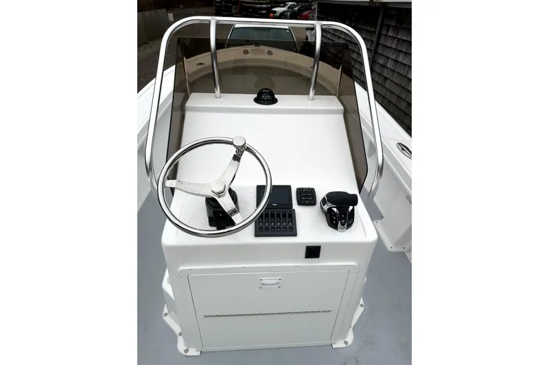 Slide: The Image of Steiger Craft 21 Classic 2025 boat console with steering wheel and controls. - 4