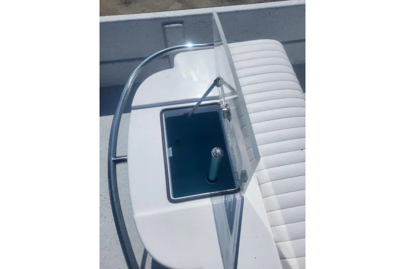 Slide: The Image of 2024 Maritime 2090 Skiff boat seat with storage compartment and protective railing. - 9