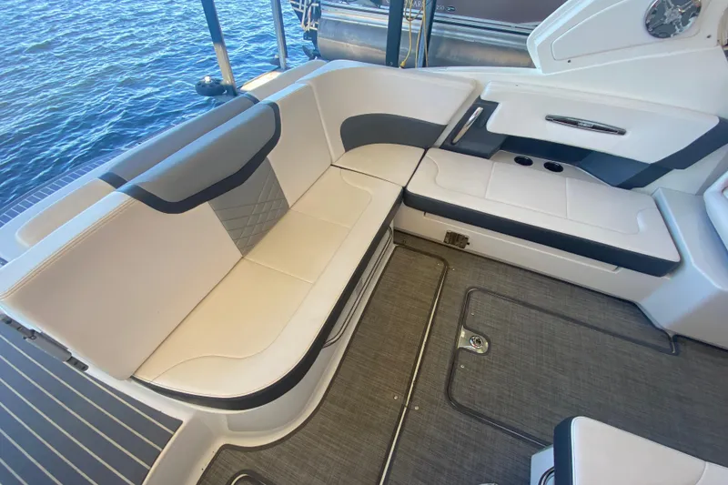 Slide: The Image of 2018 Chaparral 337 SSX boat interior with sleek seating and modern design. - 13