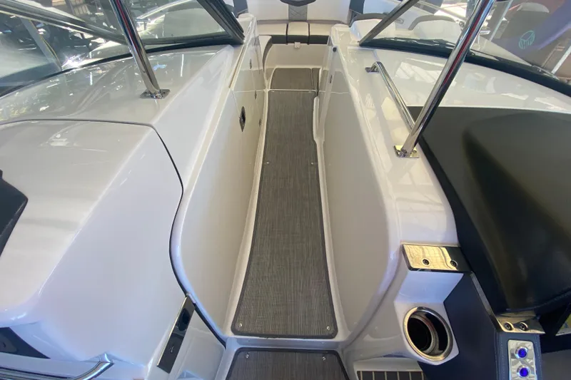 Slide: The Image of 2018 Chaparral 337 SSX boat interior with sleek walkway and modern design elements. - 35
