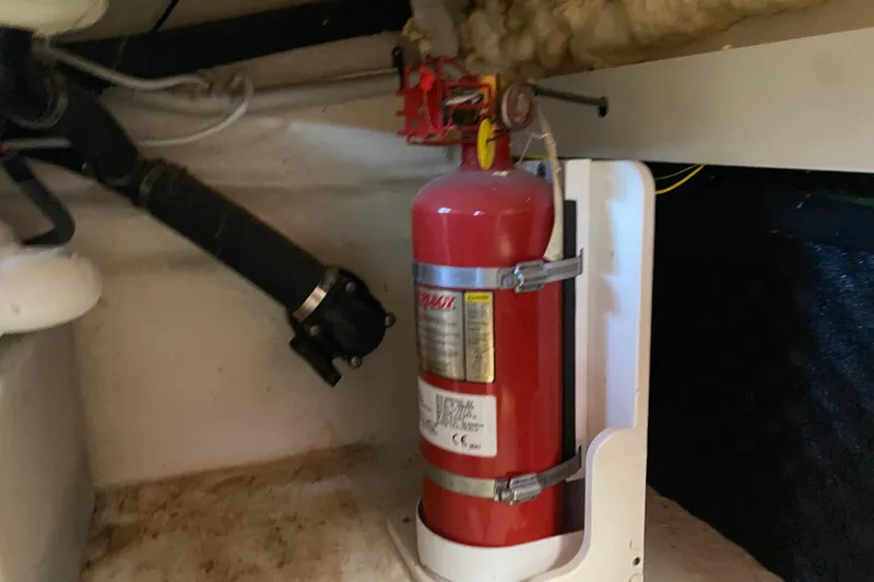 Slide: The Image of Fire extinguisher mounted in 2018 Chaparral 337 SSX boat interior. - 49
