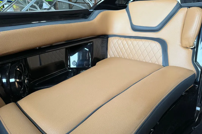 Slide: The Image of Luxurious tan seating in 2026 Yamaha Boats 275SD, featuring elegant stitching and sleek design. - 10