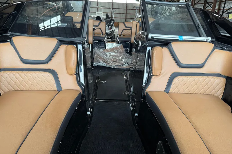 Slide: The Image of 2026 Yamaha Boats 275SD interior with tan leather seating and modern design. - 11