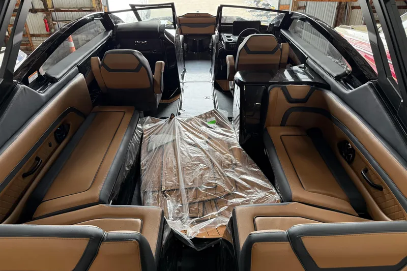 Slide: The Image of Interior of 2026 Yamaha Boats 275SD, featuring luxurious brown and black seating. - 4