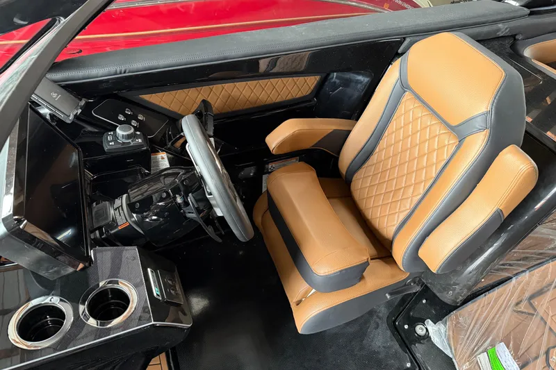 Slide: The Image of 2026 Yamaha Boats 275SD cockpit with luxurious tan leather seating and modern controls. - 6