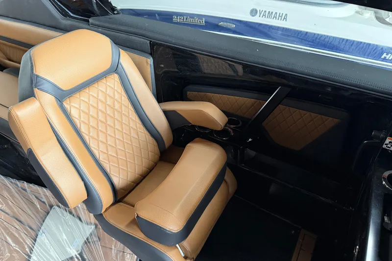 Slide: The Image of 2026 Yamaha Boats 275SD interior with tan and black leather seating. - 8