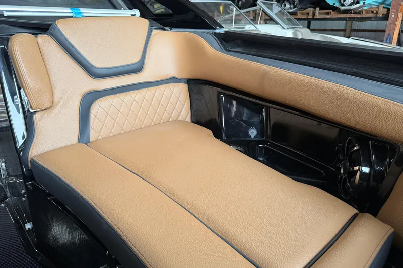 Slide: The Image of Luxurious tan seating in 2026 Yamaha Boats 275SD, featuring diamond stitching and sleek black accents. - 9