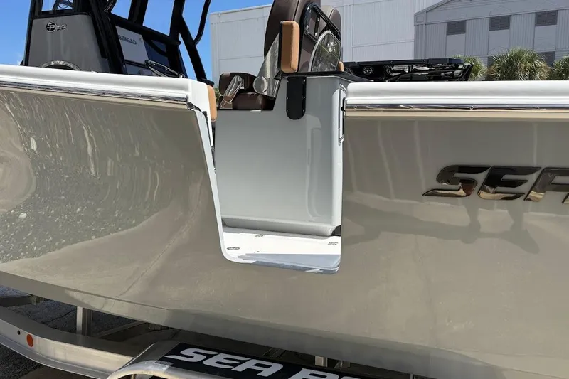 Slide: The Image of 2026 Sea Pro 262 Offshore boat with open side door, showcasing sleek design. - 10