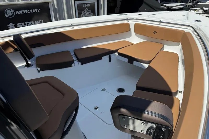 Slide: The Image of 2026 Sea Pro 262 Offshore boat interior with brown cushioned seating. - 12
