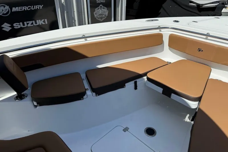 Slide: The Image of 2026 Sea Pro 262 Offshore boat interior with tan cushioned seating. - 13