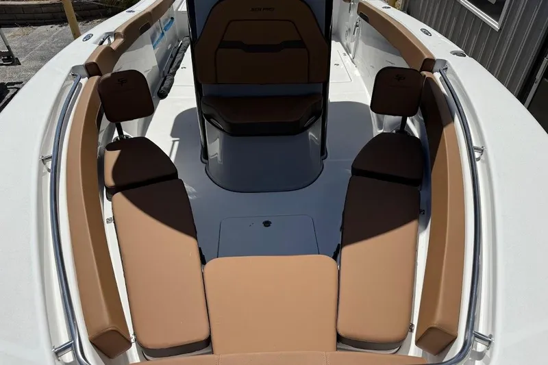 Slide: The Image of 2026 Sea Pro 262 Offshore boat interior with tan seating and sleek design. - 15