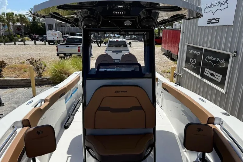 Slide: The Image of 2026 Sea Pro 262 Offshore boat interior with tan seating and modern design. - 16