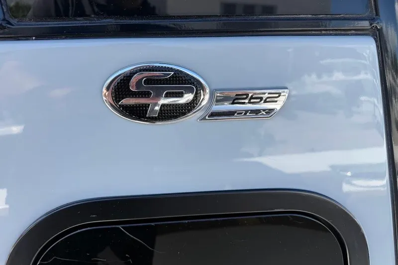 Slide: The Image of 2026 Sea Pro 262 Offshore emblem on a sleek boat exterior. - 17