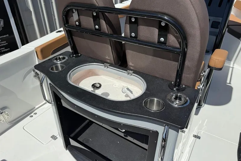 Slide: The Image of 2026 Sea Pro 262 Offshore boat interior with seating and storage compartments. - 18