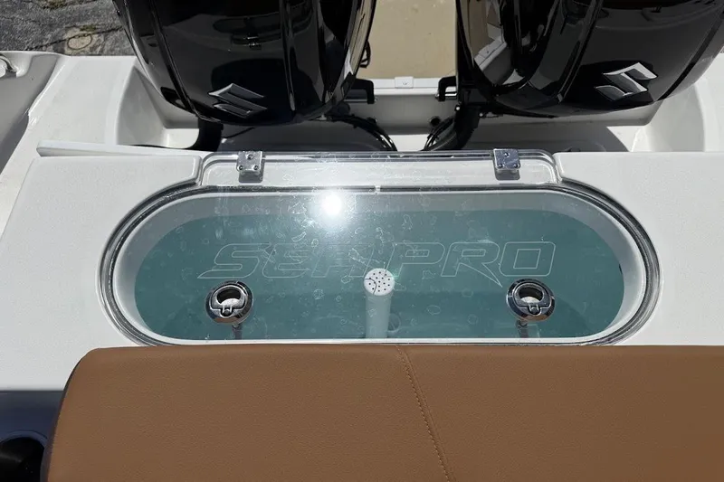 Slide: The Image of 2026 Sea Pro 262 Offshore boat with dual engines and livewell. - 21