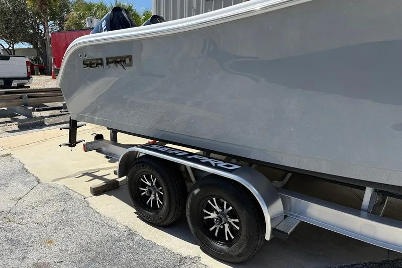 Slide: The Image of 2026 Sea Pro 262 Offshore boat on trailer, parked outdoors. - 5