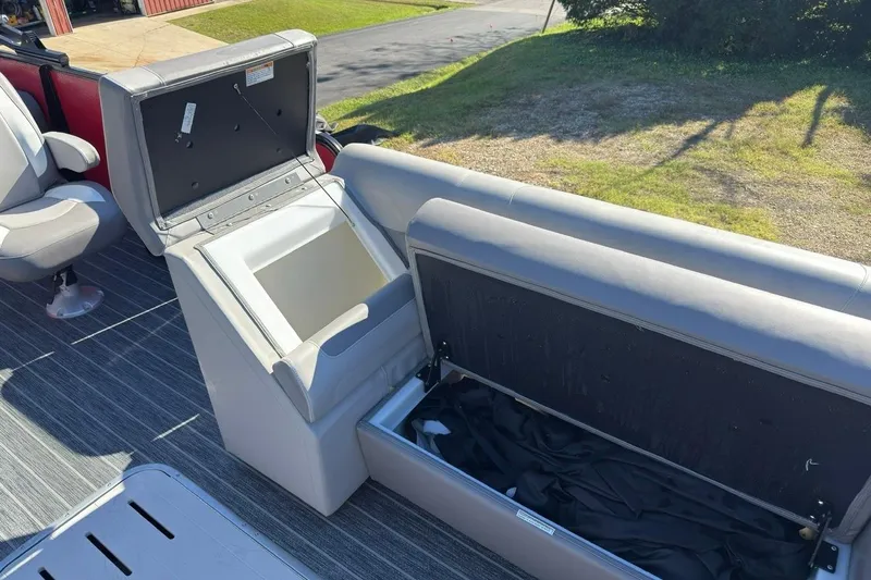 Slide: The Image of 2024 Premier 250 Solaris boat interior with open storage compartments and seating. - 10