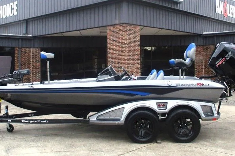 The Image of 2026 Ranger Z518 Cup-Equipped boat on trailer, parked outside a building. - 1