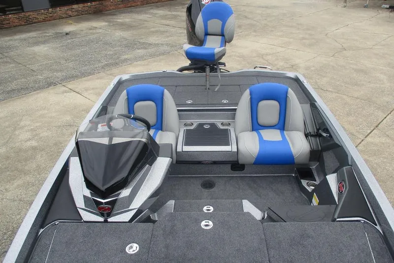 Slide: The Image of 2026 Ranger Z518 Cup-Equipped boat interior with blue and gray seating. - 4