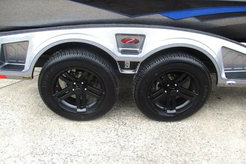 Slide: The Image of 2026 Ranger Z518 Cup-Equipped trailer with black alloy wheels on concrete surface. - 7