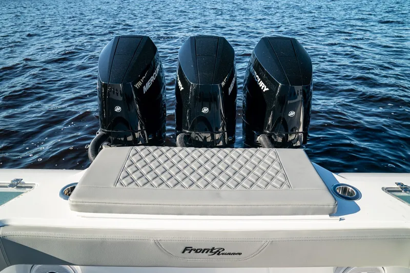 Slide: The Image of 2026 Front Runner 36' Center Console with triple Mercury engines on open water. - 10