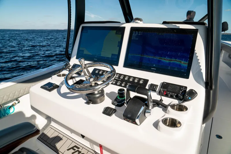 Slide: The Image of Helm of 2026 Front Runner 36' Center Console with advanced navigation displays. - 19