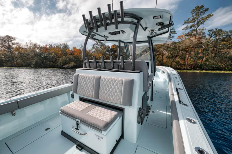 Slide: The Image of 2026 Front Runner 36' Center Console boat on a scenic lake. - 3