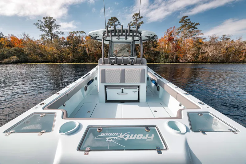 Slide: The Image of 2026 Front Runner 36' Center Console boat on a scenic lake with autumn trees. - 5