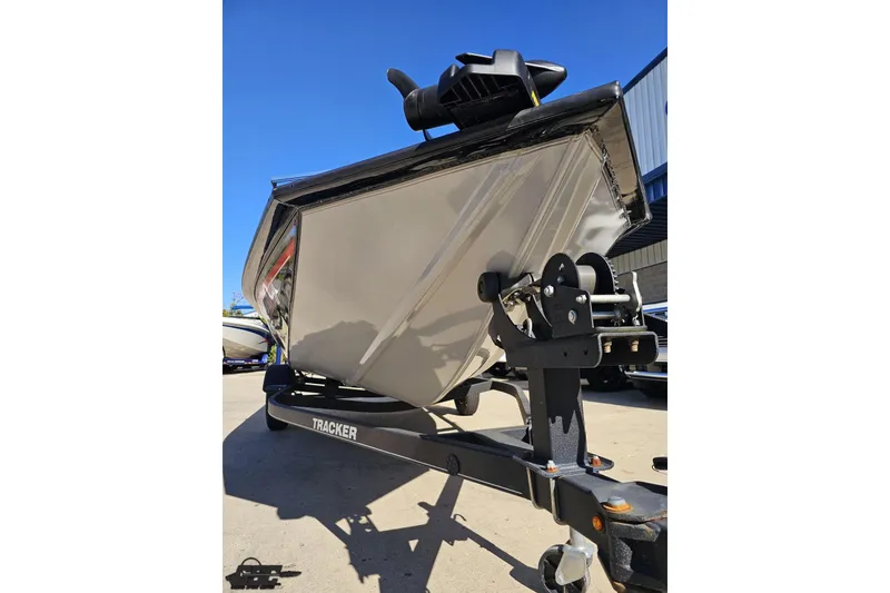 Slide: The Image of 2018 Tracker Pro Team 175 TXW boat on trailer under clear blue sky. - 19