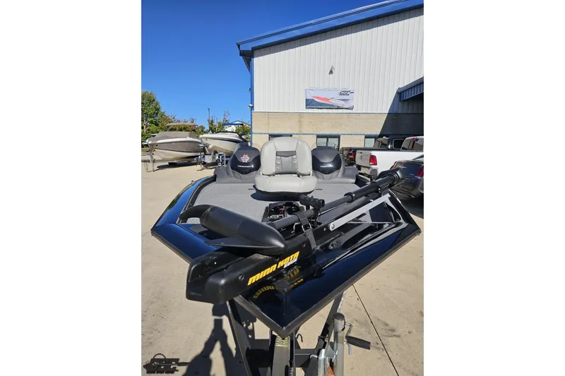 Slide: The Image of 2018 Tracker Pro Team 175 TXW boat with trolling motor, parked outdoors. - 20