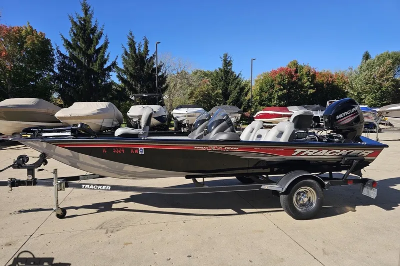 Slide: The Image of 2018 Tracker Pro Team 175 TXW boat on trailer, parked outdoors. - 23