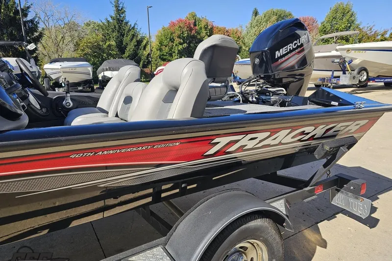 Slide: The Image of 2018 Tracker Pro Team 175 TXW boat, 40th Anniversary Edition, with Mercury engine, parked outdoors. - 25
