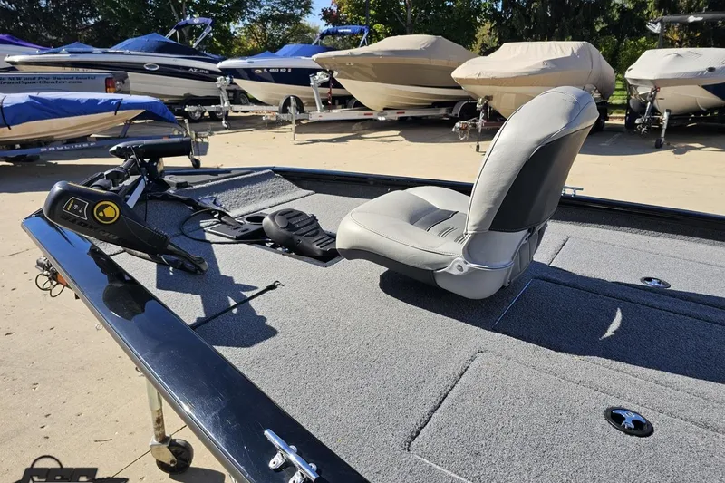 Slide: The Image of 2018 Tracker Pro Team 175 TXW boat with gray seating and trolling motor. - 27