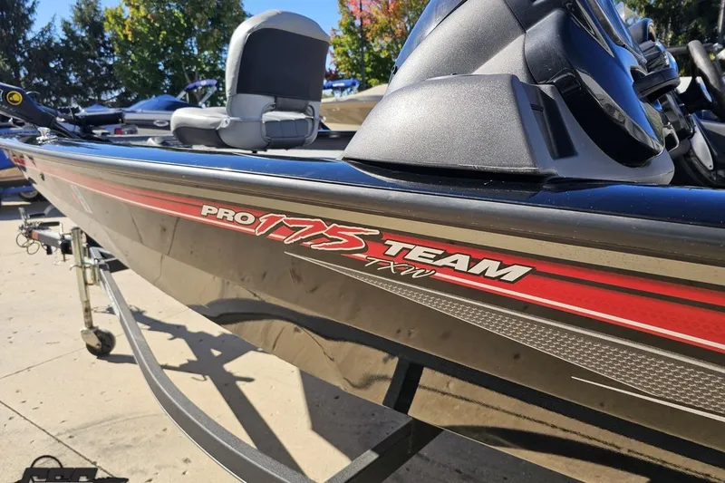Slide: The Image of 2018 Tracker Pro Team 175 TXW boat on trailer, side view with red detailing. - 31