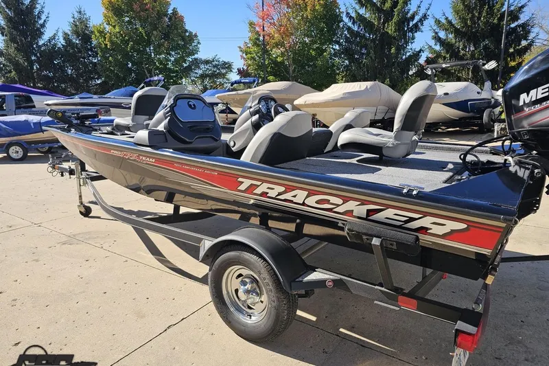 Slide: The Image of 2018 Tracker Pro Team 175 TXW boat on trailer, parked outdoors. - 34