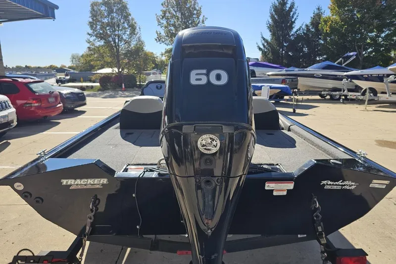 Slide: The Image of 2018 Tracker Pro Team 175 TXW boat with 60 HP engine in a parking lot. - 39